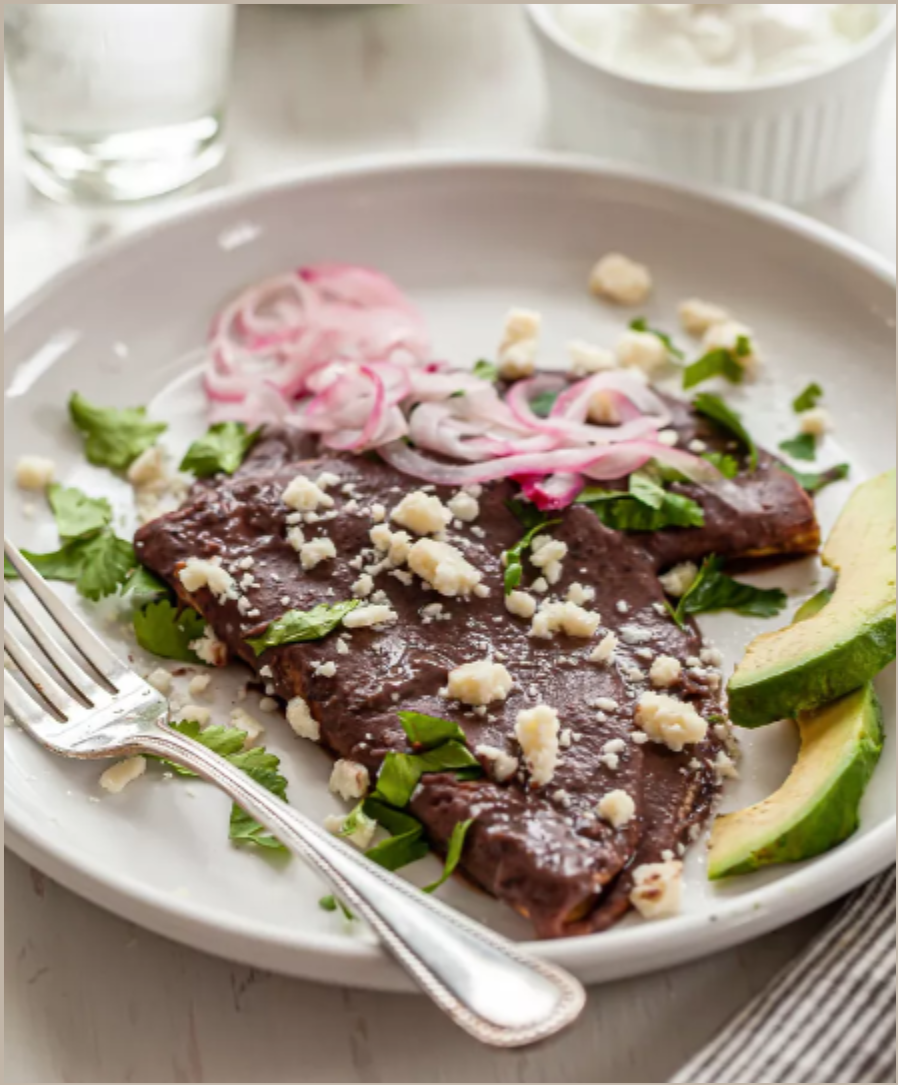 Enfrijoladas with Black Beans, Avocado and Cotija.