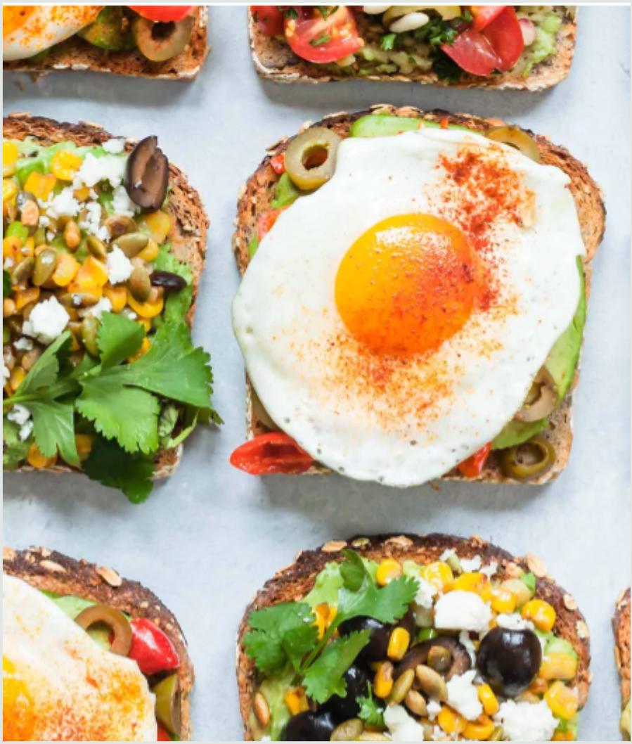 Avocado Toasts With Fried Egg, Olives, and Smoked Paprika.